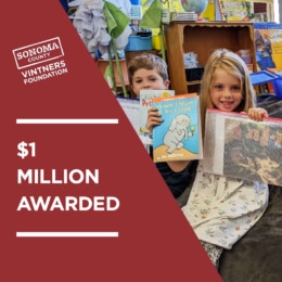 SCVF $1 Million Awarded with children holding books