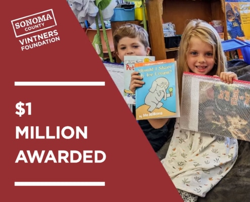 SCVF $1 Million Awarded with children holding books