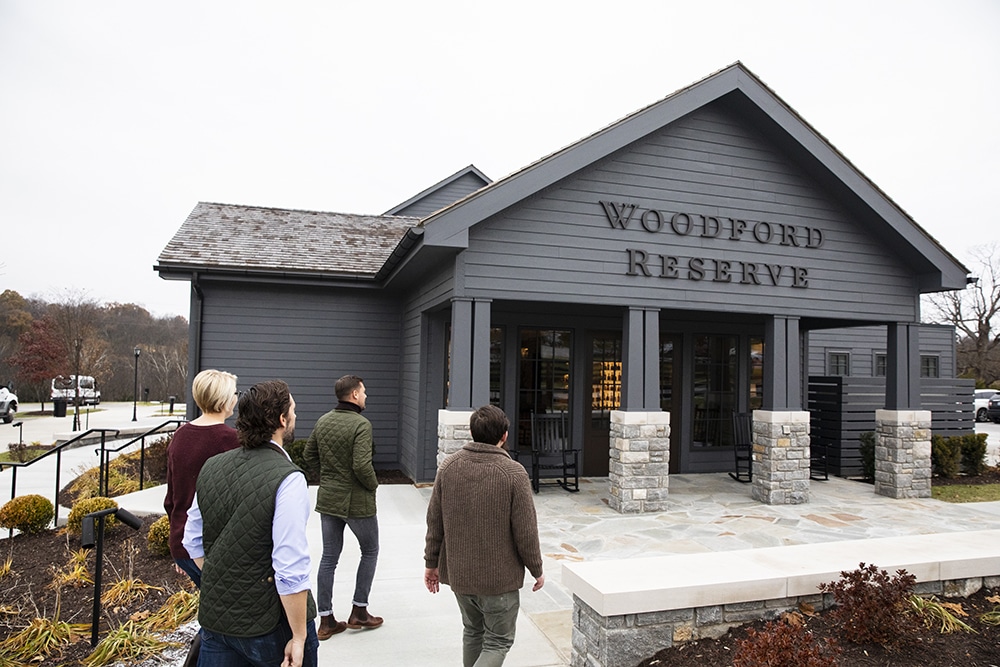 People walking into Woodford Reserve building