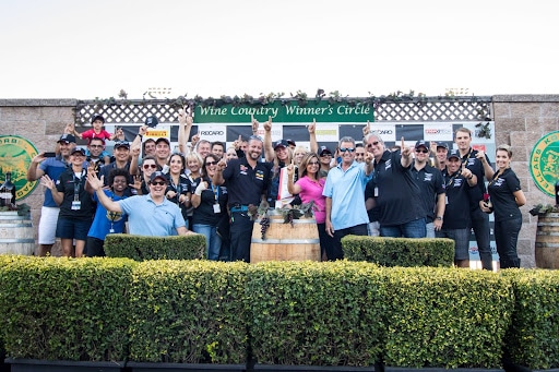 People gathered at the wine country winner's circle