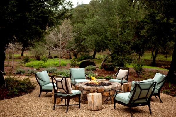 Fire pit with chairs around it